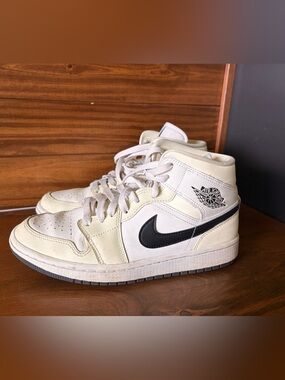 Air Jordan 1 Mid sneakers in colour way ‘coconut milk’